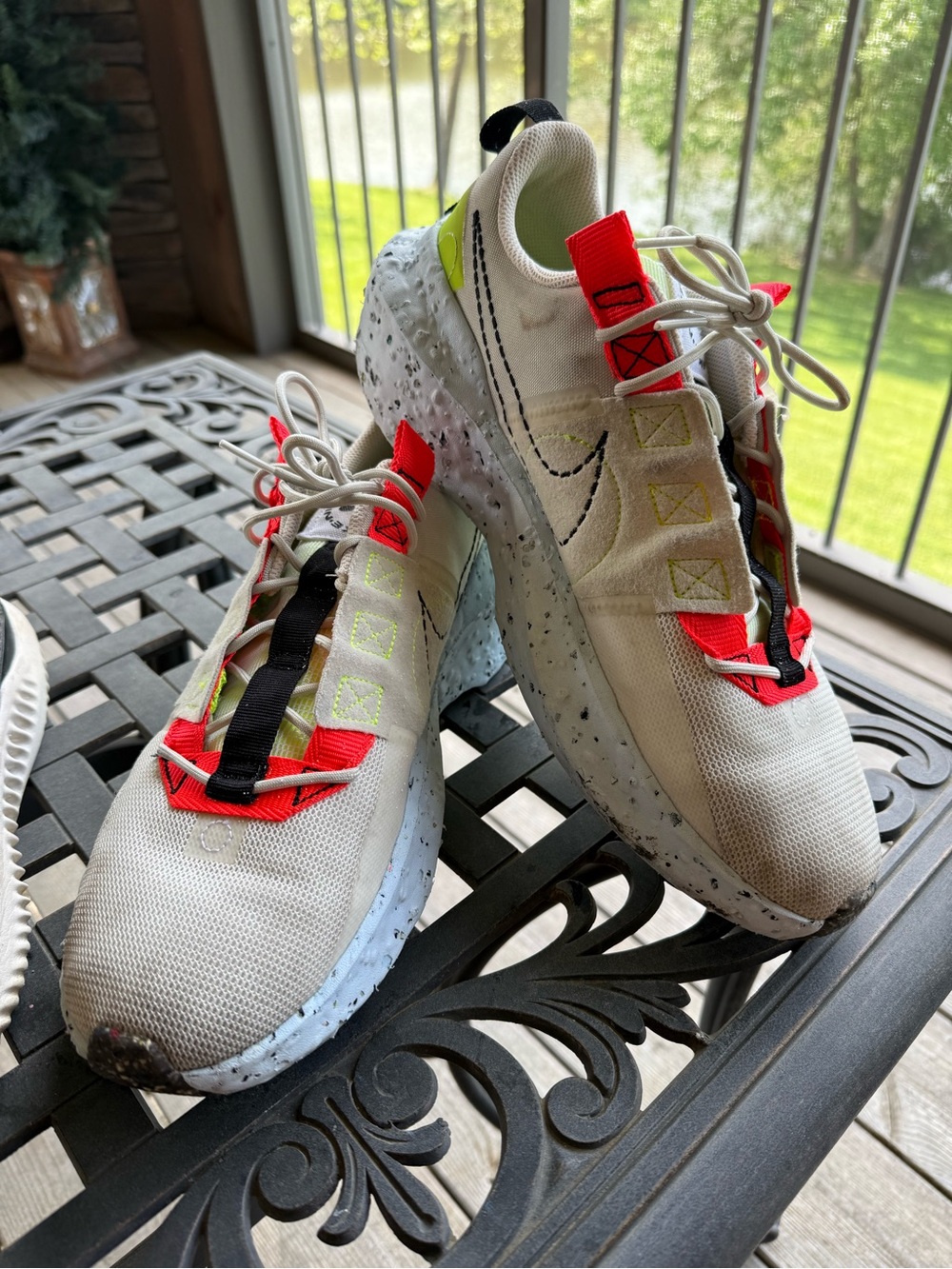 Nike white sneakers with neon yellow and bright red accents